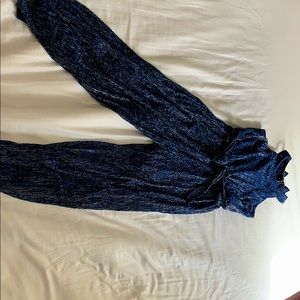 A blue and silver jumper. Never been worn.